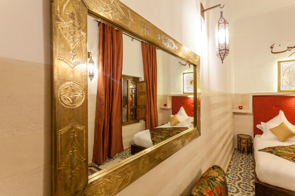 Postel nebo postele na pokoji v ubytování Riad Dar Yema