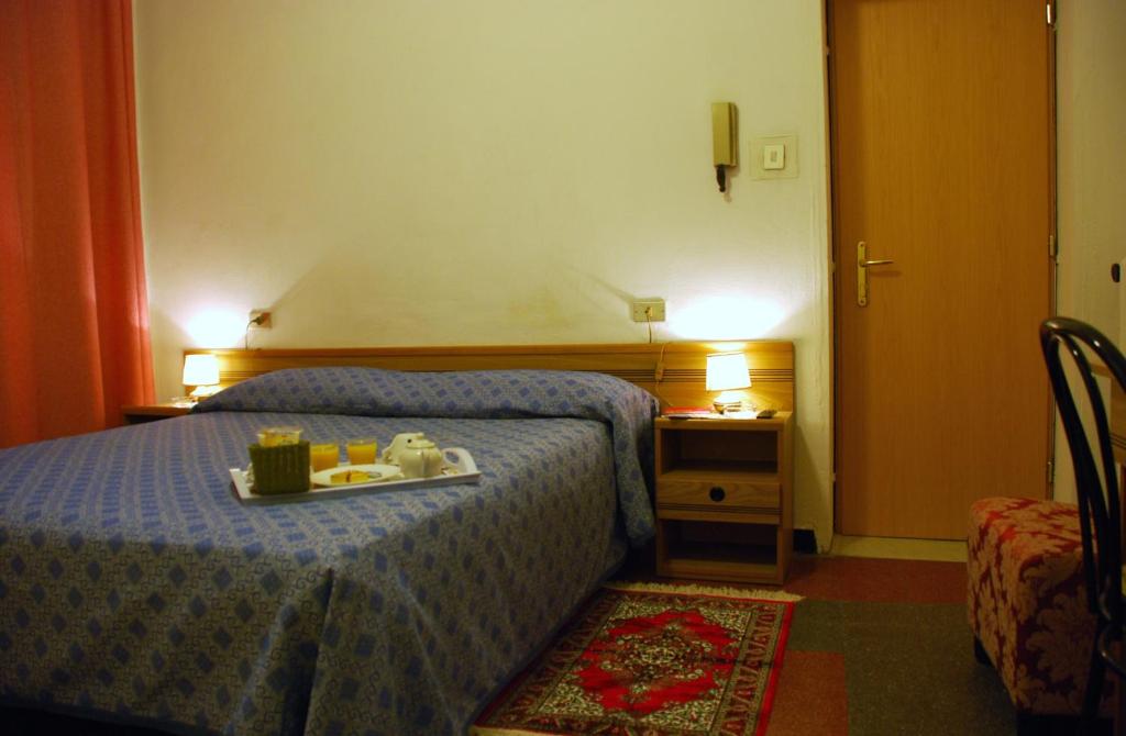Postel nebo postele na pokoji v ubytování Hotel Major