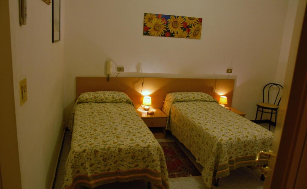 Postel nebo postele na pokoji v ubytování Hotel Major