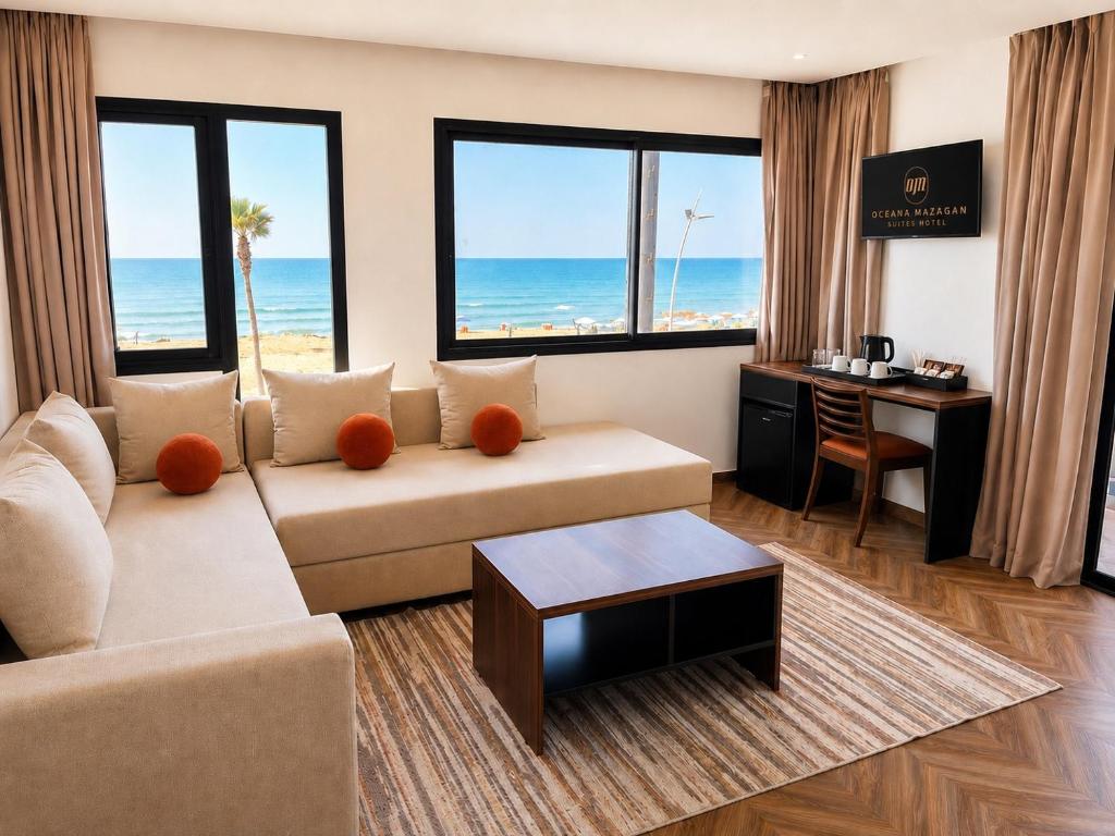a living room with a view of the ocean at Oceana Mazagan Suites Hôtel in El Jadida