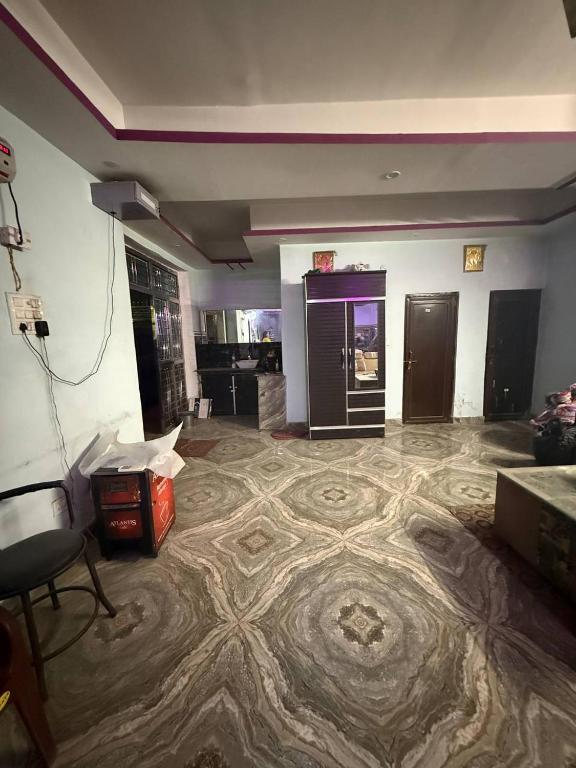 a living room with a carpeted floor in a room at Dixit's Villa! in Kānpur