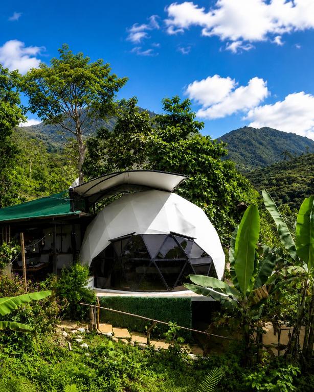 a building in the middle of a forest at Kayala Domes - Unique Luxury Domes in the Mountains - 4x4 recommended in La Ese