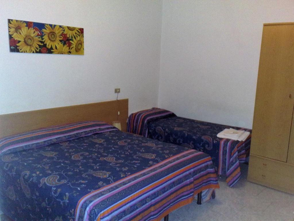 Postel nebo postele na pokoji v ubytování Hotel Major