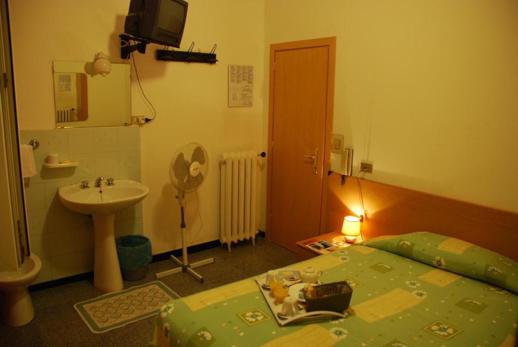 Postel nebo postele na pokoji v ubytování Hotel Major