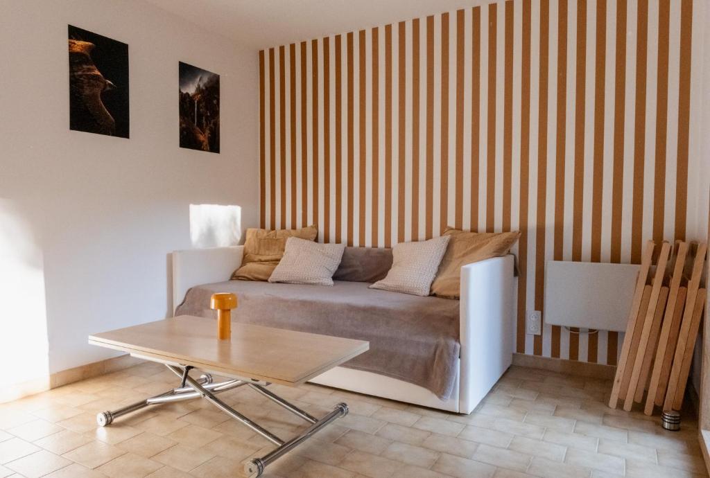 a living room with a couch and a table at La VilLaye in Laye