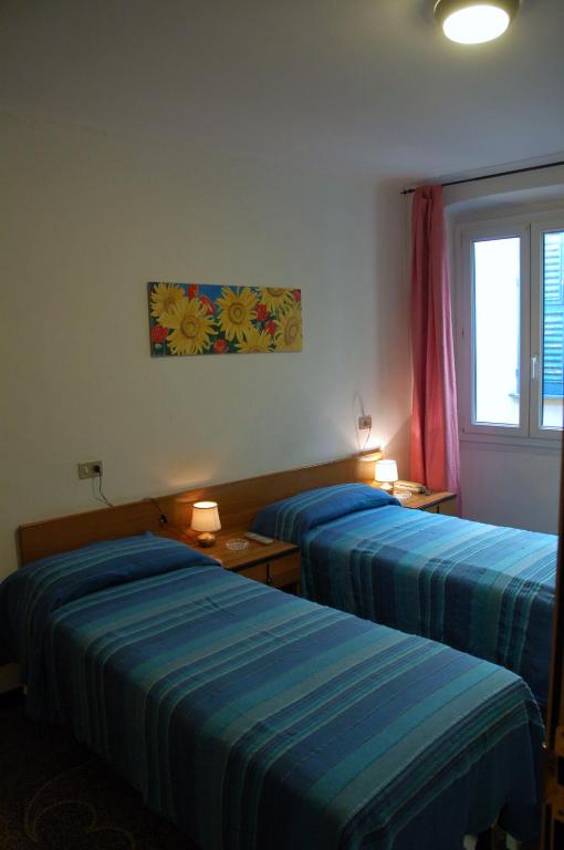 Postel nebo postele na pokoji v ubytování Hotel Major