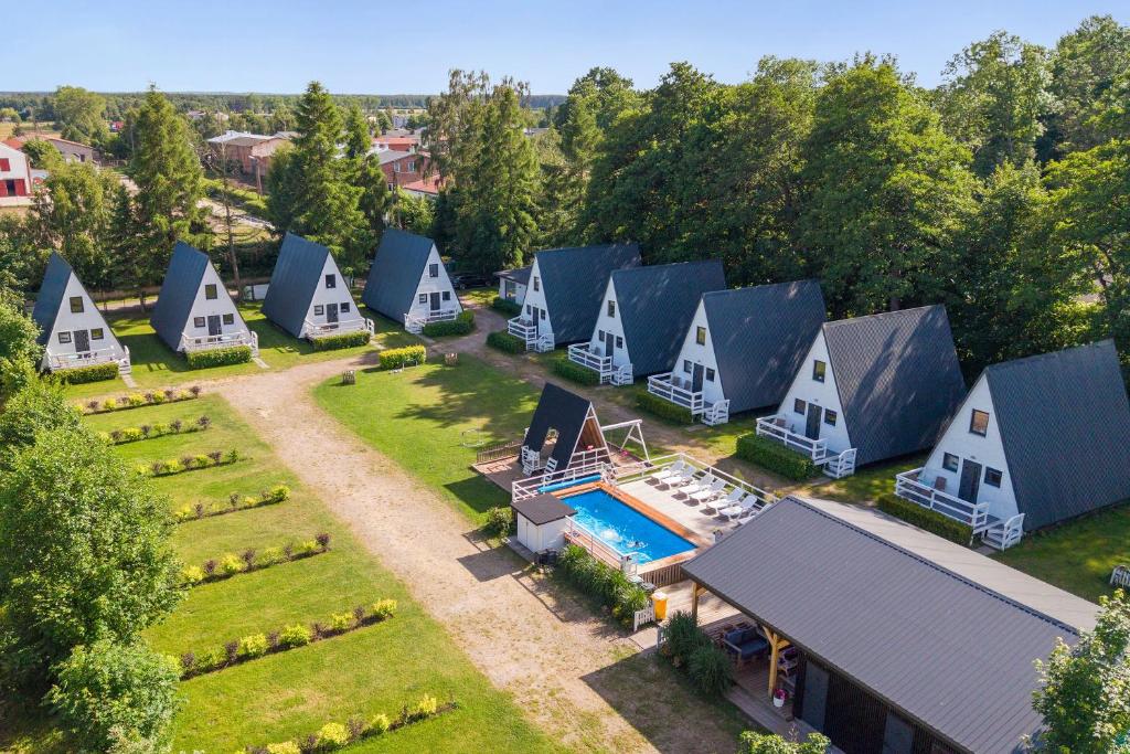 an aerial view of a row of houses with a pool at Soul Camp Nowęcin in Łeba