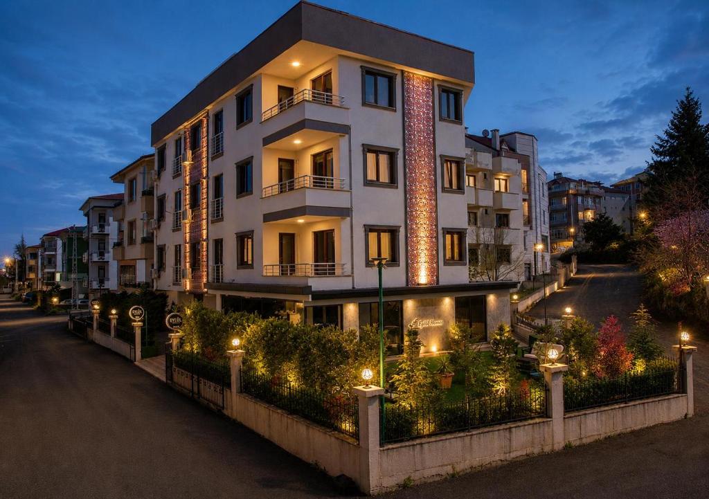 a building with lights on the side of a street at Eylül Homes in Trabzon