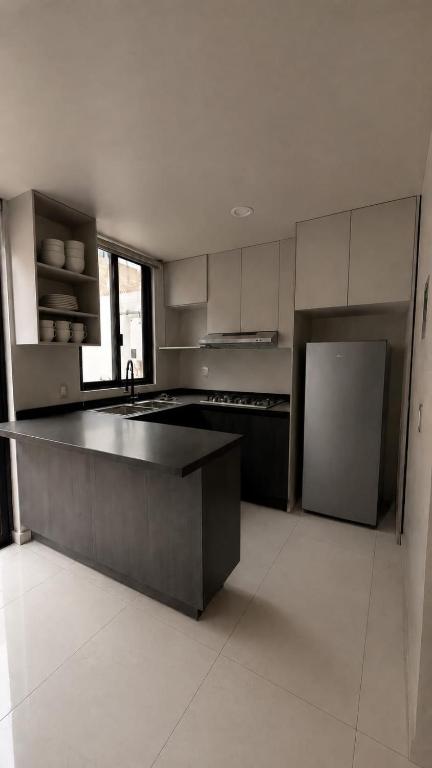 a large kitchen with a sink and a refrigerator at Bowra World Cup House, Akron Stadium 5 in Guadalajara