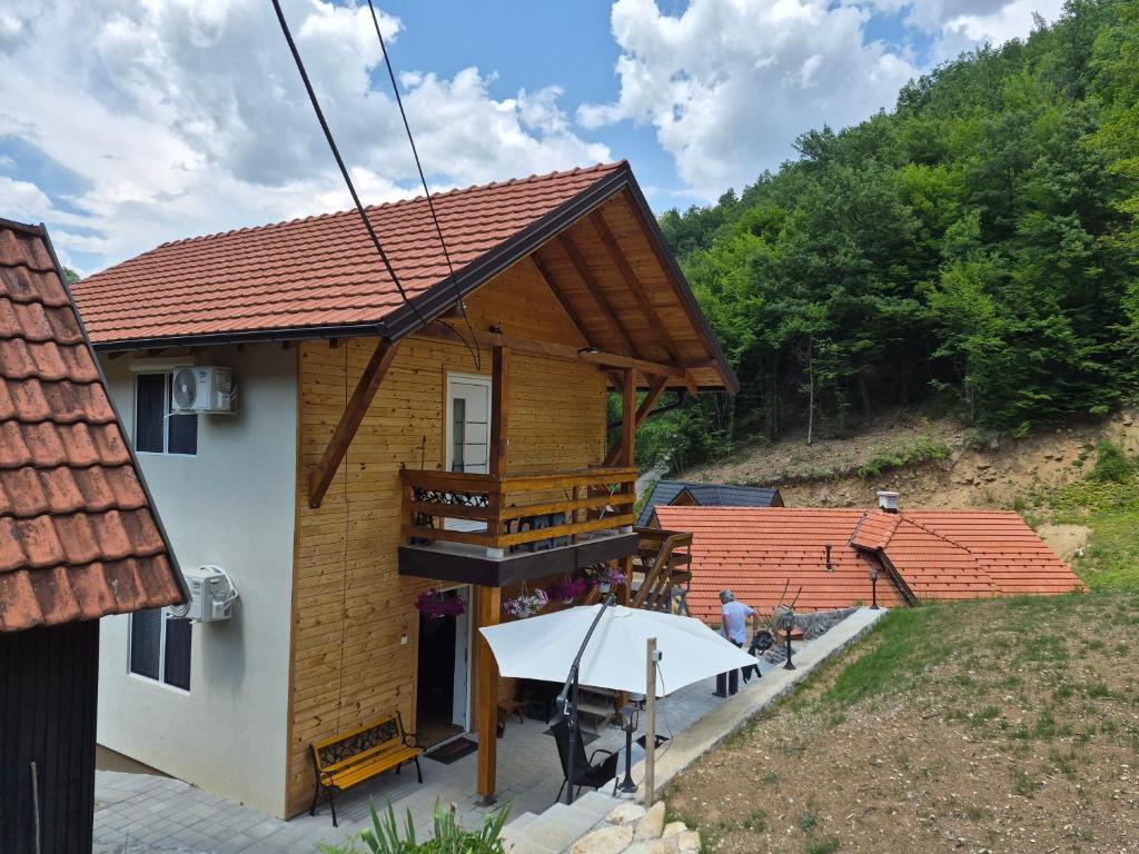 a small house with a roof on top of it at Visočka Banja Apartmani in Arilje