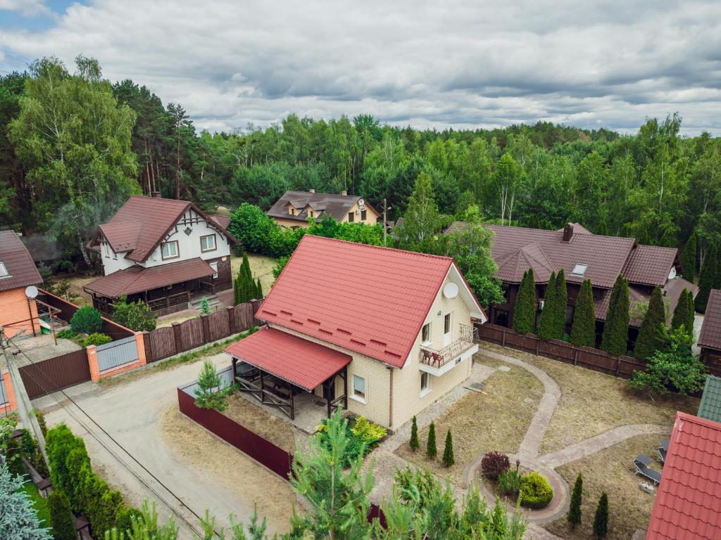 an overhead view of a house with a red roof at Всім бобра in Pulʼmo
