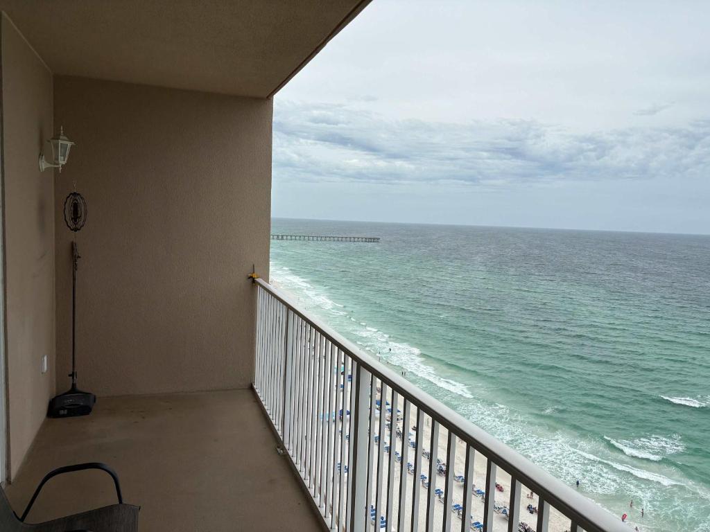a balcony with a view of the ocean at Oceanfront Condo with Shared Pool Hot Tub & Gym in Panama City Beach