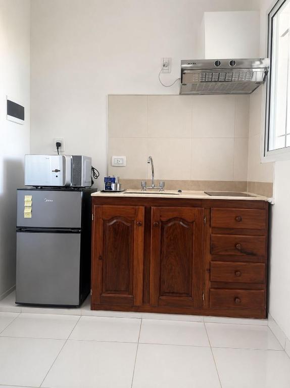 a kitchen with a sink and a refrigerator at Departamento in Formosa