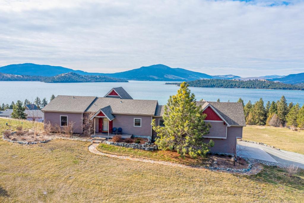 a home with a view of a lake and mountains at Breathtaking Mtn & Lake Views! Glacier Country Gem in Dayton