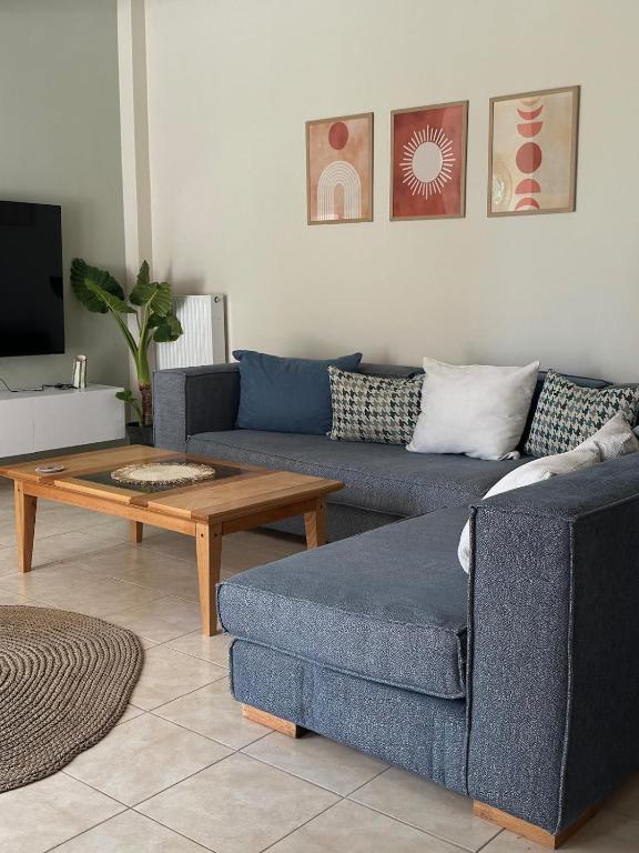 a living room with a couch and a coffee table at Apollonian House in Korinthos