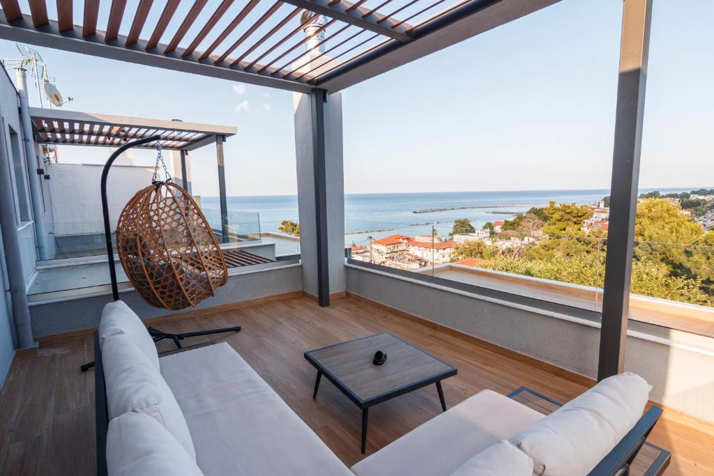 a living room with a view of the ocean at CASA UNO Horizon in Platamonas