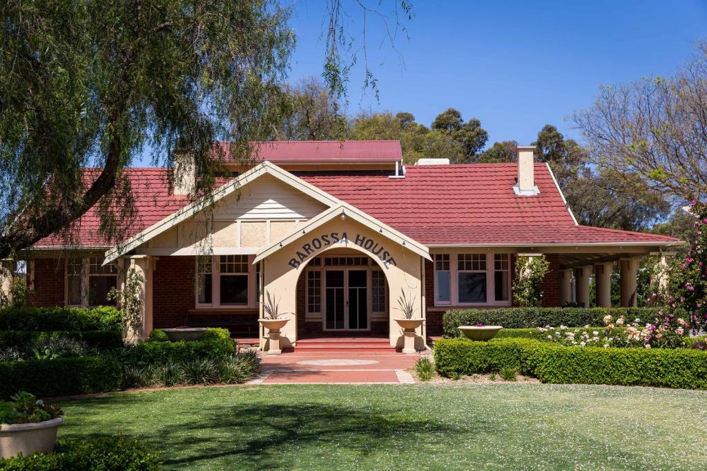 a house with a red roof and a driveway at Barossa House in Tanunda