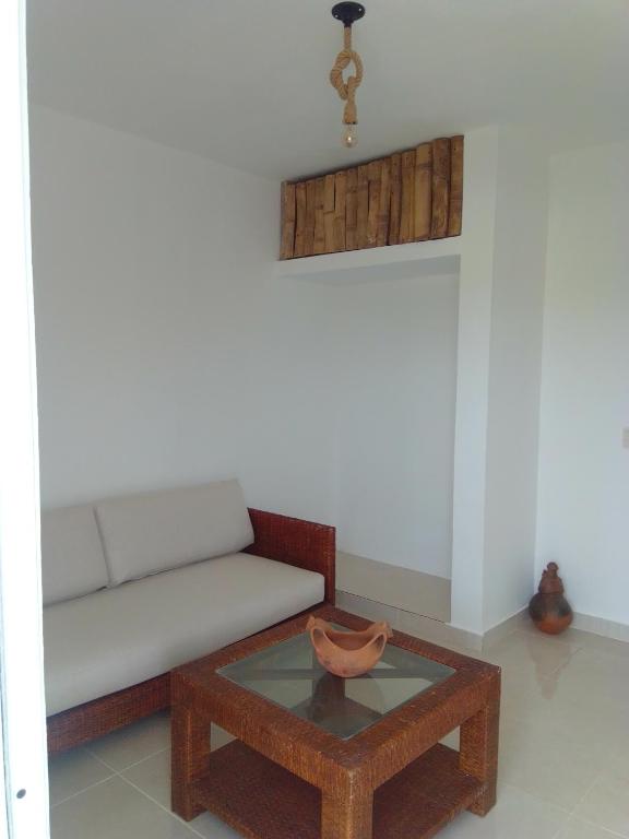a living room with a couch and a coffee table at Macao Sky pool Suite in Punta Cana