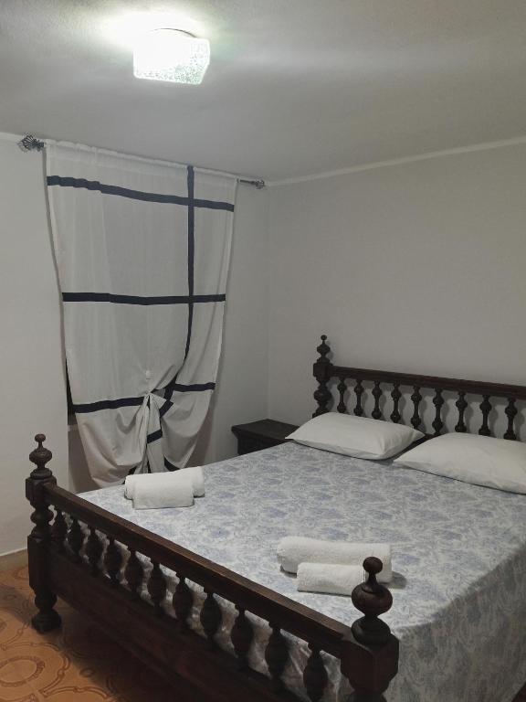 a bedroom with a bed with two towels on it at La vigna in Costigliole dʼAsti