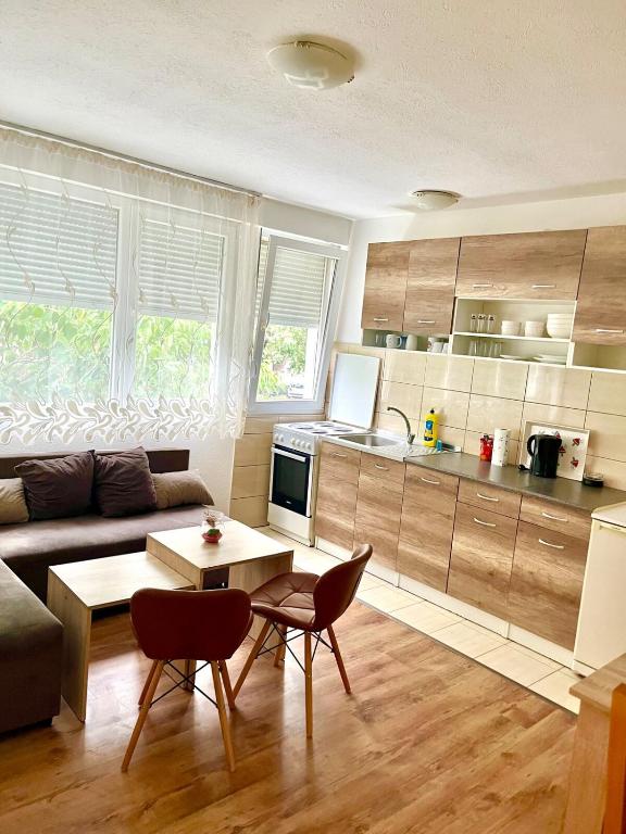 a living room with a couch and a table at Tinela in Mostar