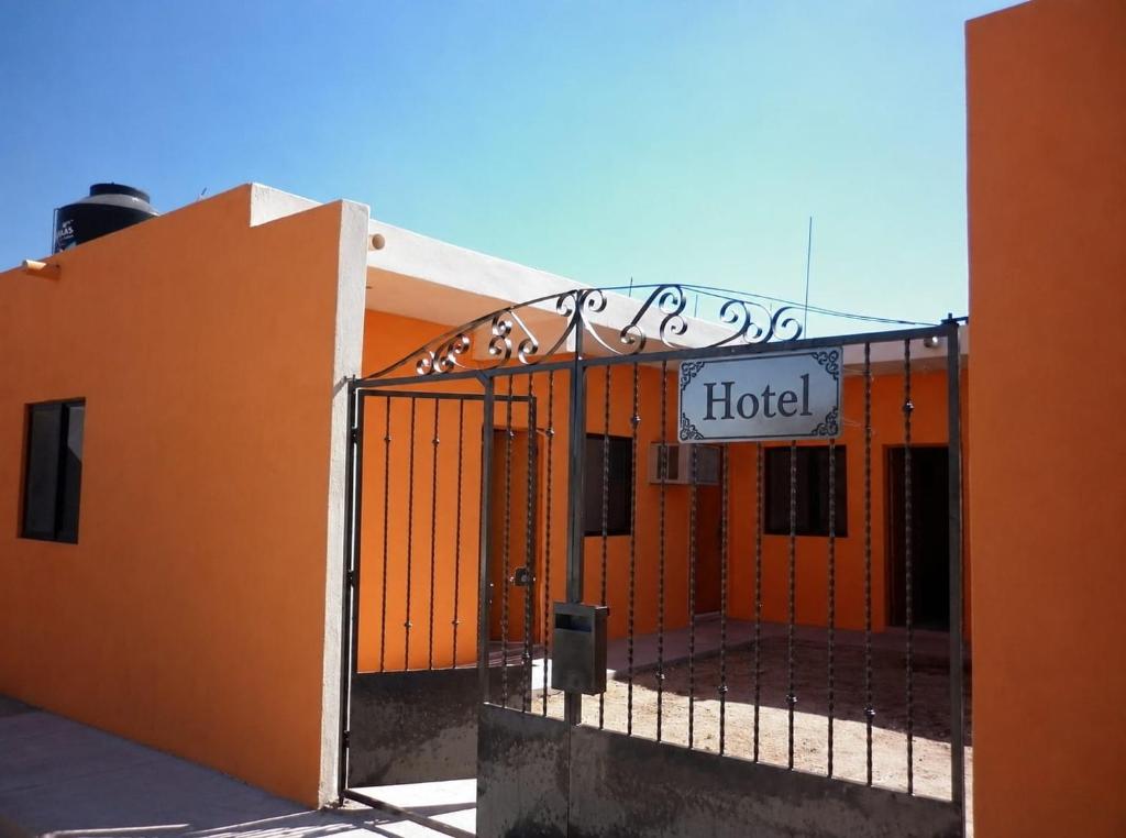 a gate to a hotel with a sign on it at Las Veredas Aeropuerto in San José del Cabo