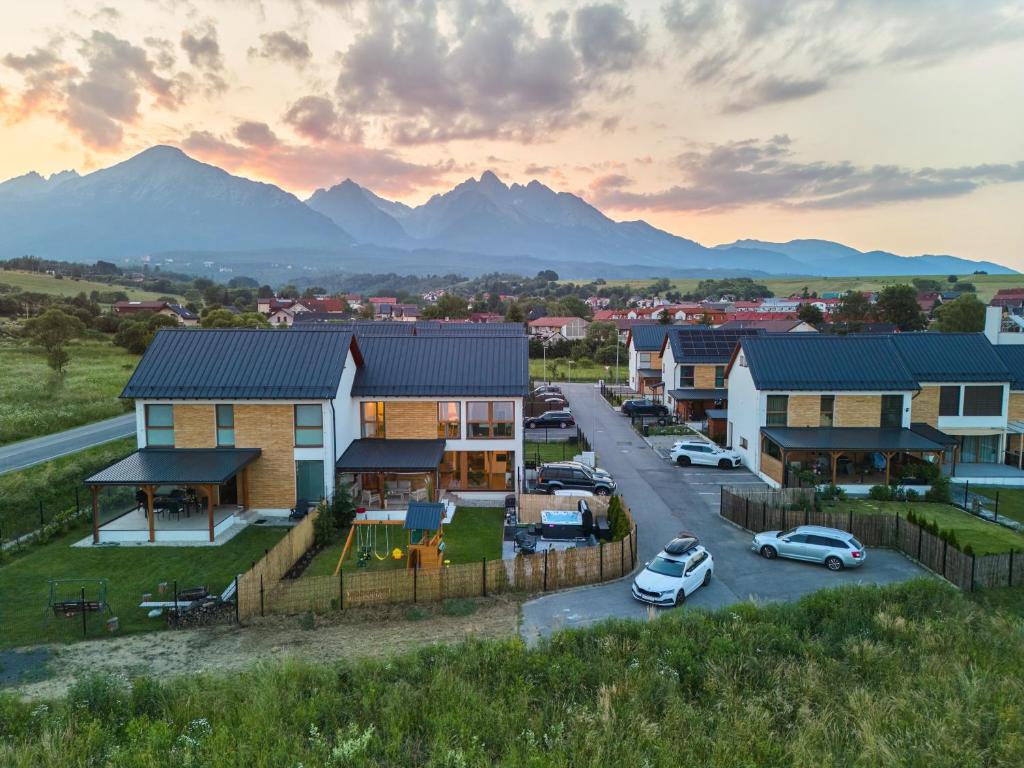 arial view of a suburb with mountains in the background at Chaletka Tatry in Nová Lesná