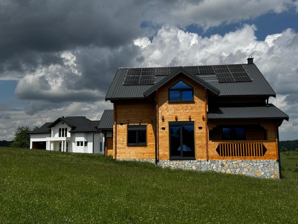 a house with solar panels on the roof at Agro Arge in Rožaje
