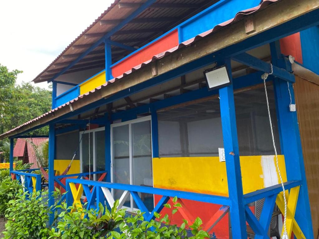 a colorful house with a colorful facade at Cabañas Guaimia in Nuquí