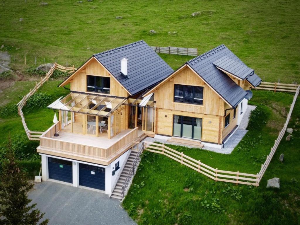 an overhead view of a large wooden house at Chalet Gipfelduo in Ebene Reichenau