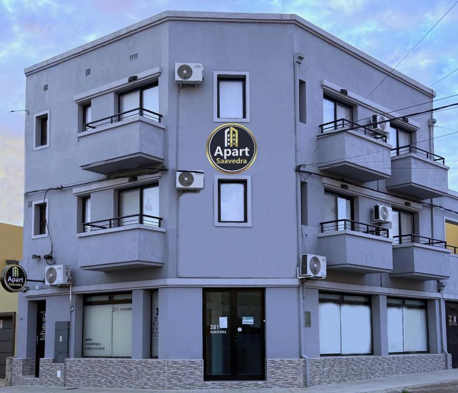 a building with a sign on the front of it at Apart Saavedra in Concordia