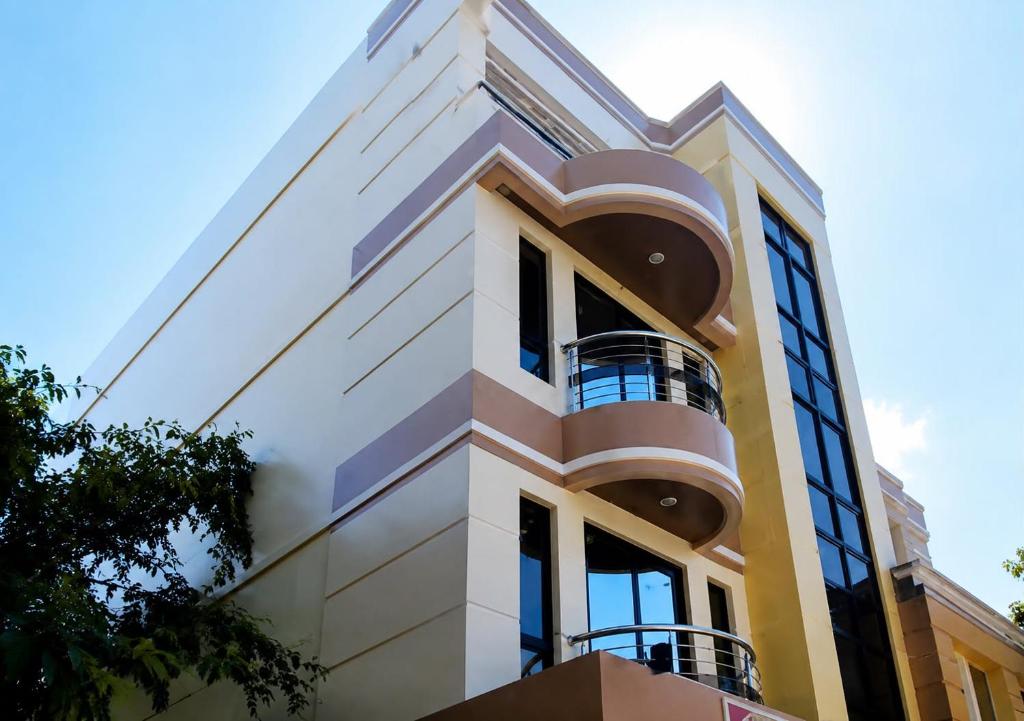 a building with balconies on the side of it at HilFrans Lodge in Vigan