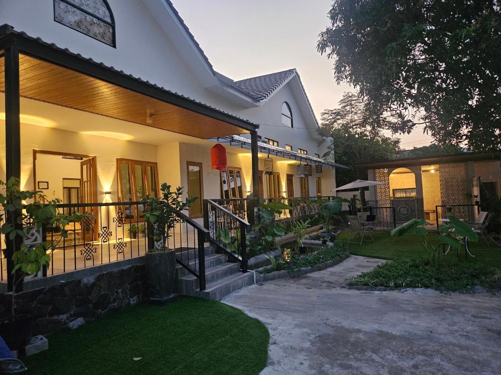 a house with a pathway in front of it at Kooka Residence Surabaya in Surabaya