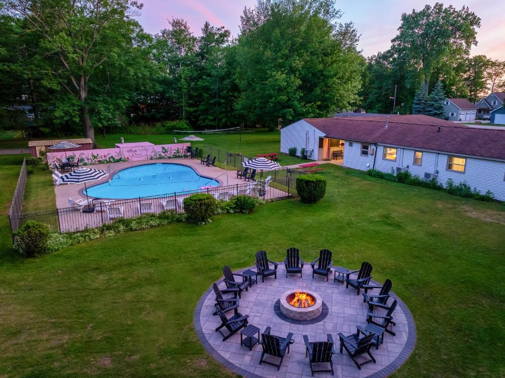 an aerial view of a backyard with a fire pit at Sun & Sand Resort in Port Austin