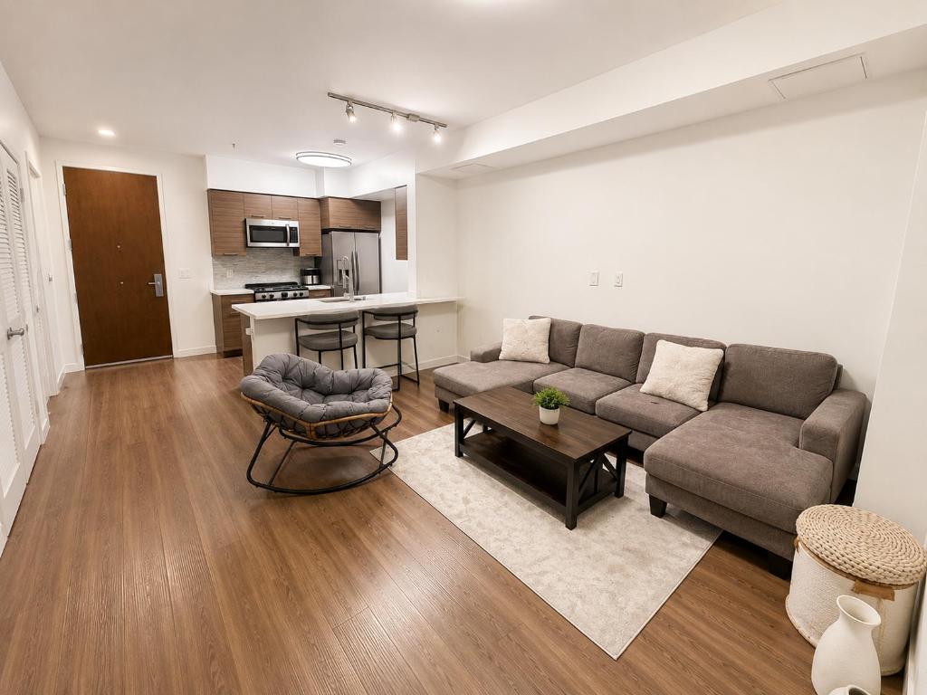 a living room with a couch and a table at Glendale Luxe Stays - Downtown in Glendale