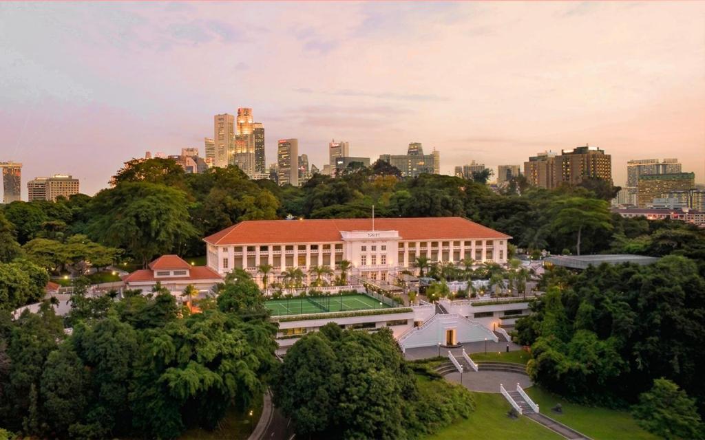 an aerial view of a building with a city in the background at METT Singapore in Singapore