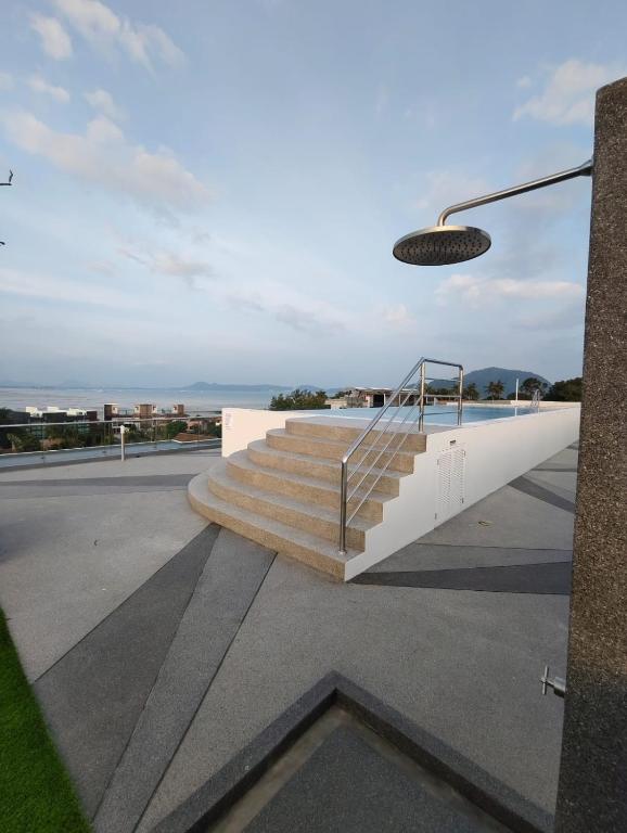 a set of stairs with a view of the ocean at Babylon Sky Garden 2 in Rawai Beach