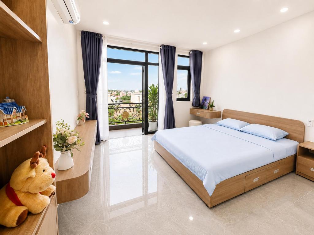 a bedroom with a large bed and a large window at Samaki Home in Ho Chi Minh City