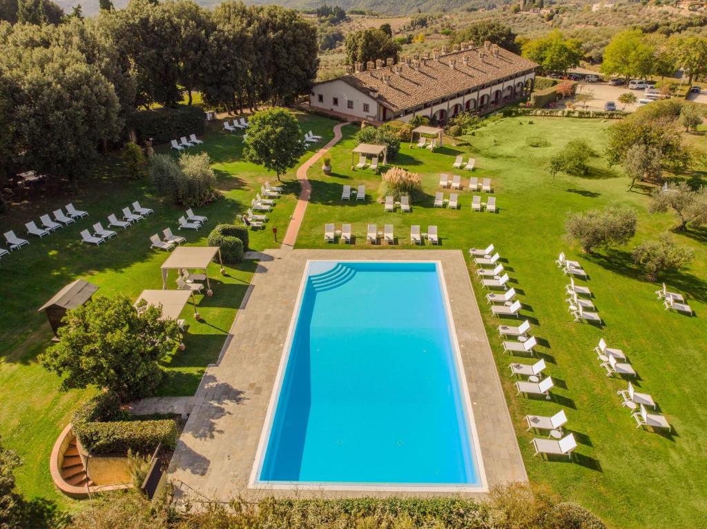 an aerial view of a resort with a swimming pool at Hotel Tenuta di Artimino member of Meliá Collection in Artimino