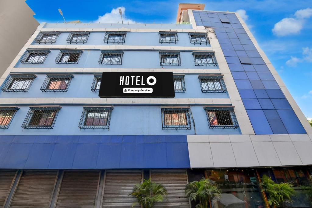 a hotel with a sign on the side of a building at Hotel O Calcutta University Formerly Hamza International in Kolkata