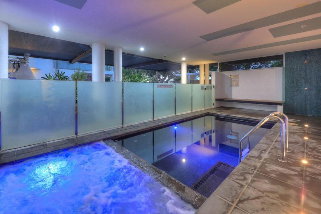 a swimming pool in a house at Maggies Beachfront Apartment 11 in Horseshoe Bay