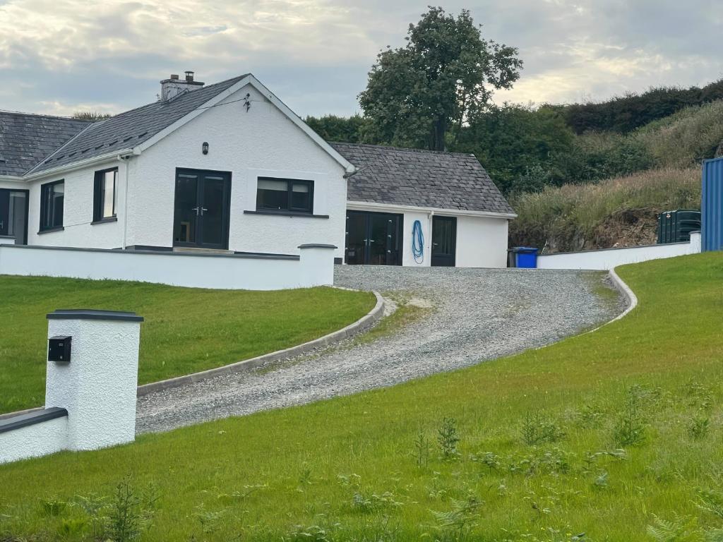 a white house with a gravel road at Rockville in Greencastle