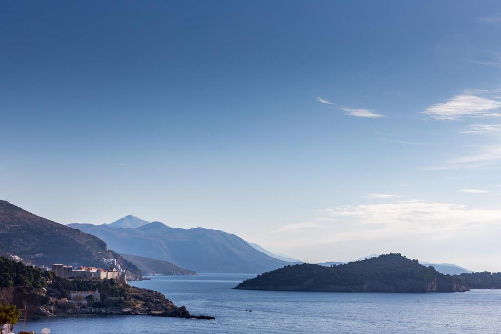 a view of a large body of water with mountains at Apartment Marko Dubrovnik in Dubrovnik