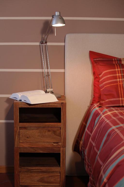 Postel nebo postele na pokoji v ubytování La Corte e l'Uva