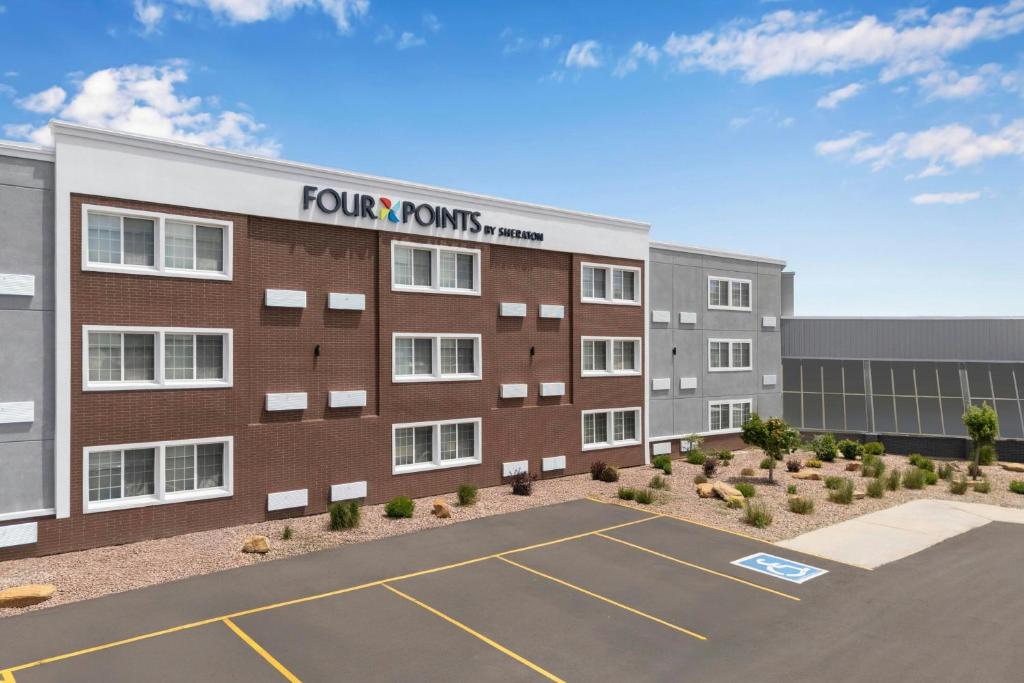 a rendering of a four points hotel with a parking lot at Four Points by Sheraton Rock Springs in Rock Springs