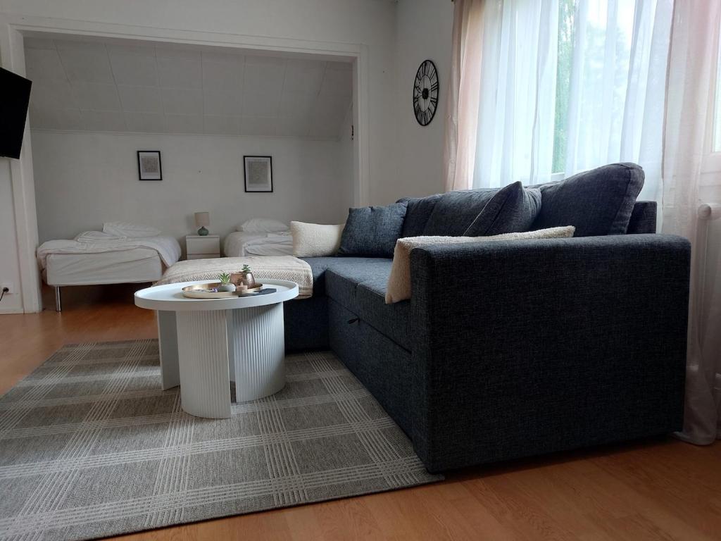 a living room with a couch and a table at Vista in Vaasa