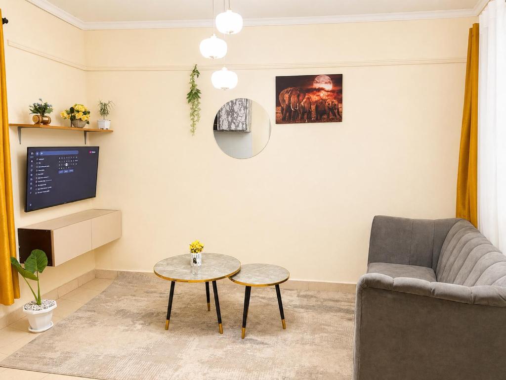 a living room with a couch and a table at Victory homes in Eldoret
