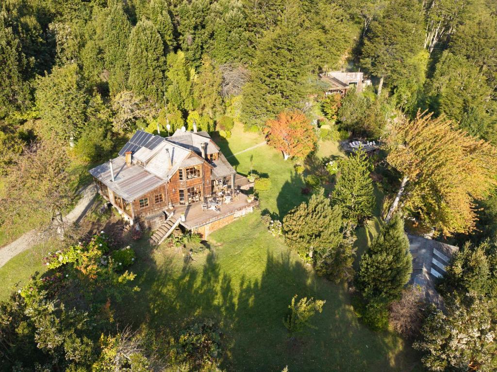 an aerial view of a large house in the woods at Barraco Lodge in Puelo