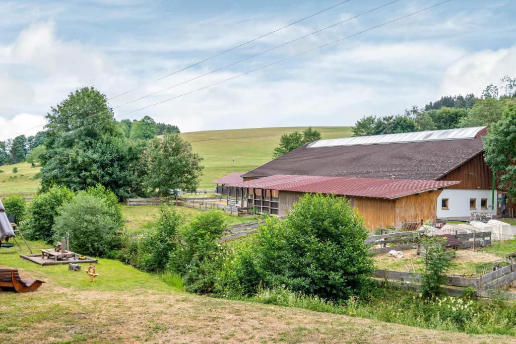 a barn in the middle of a field at Jäckleshof in Sankt Georgen im Schwarzwald