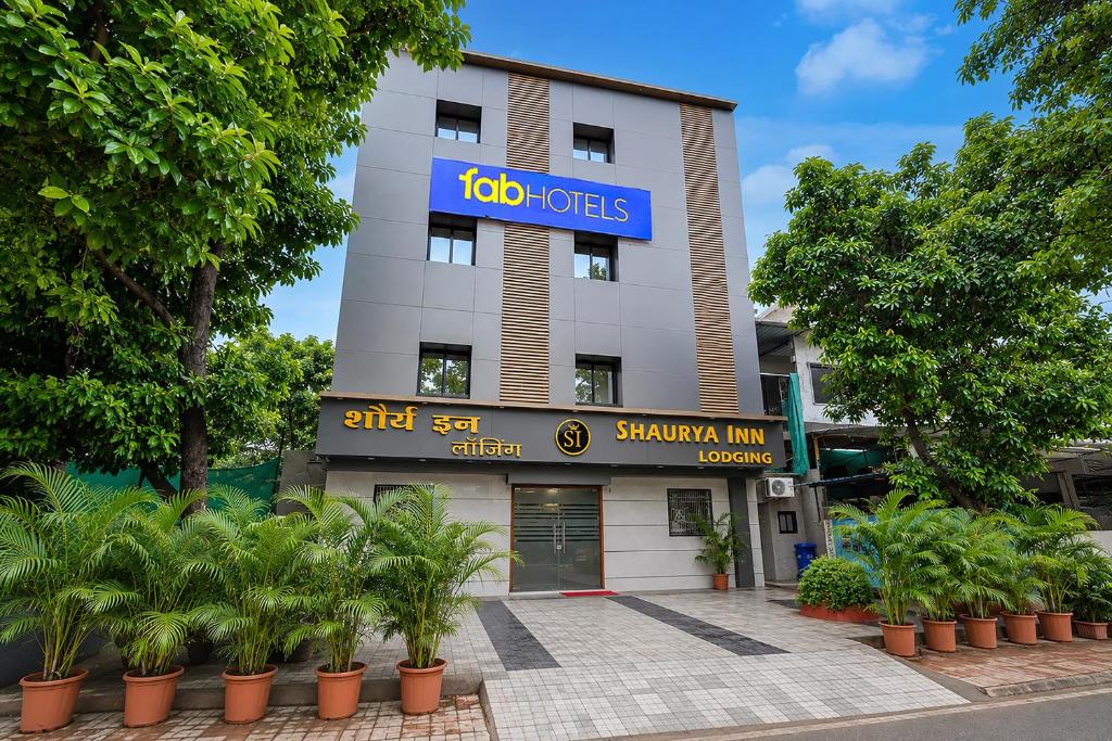 a building with a sign on the front of it at FabHotel Shaurya Inn MIDC in Ghansoli