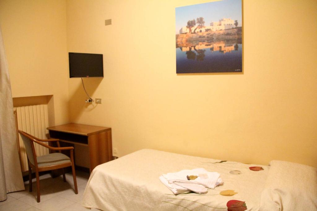 Postel nebo postele na pokoji v ubytování Hotel Cristal